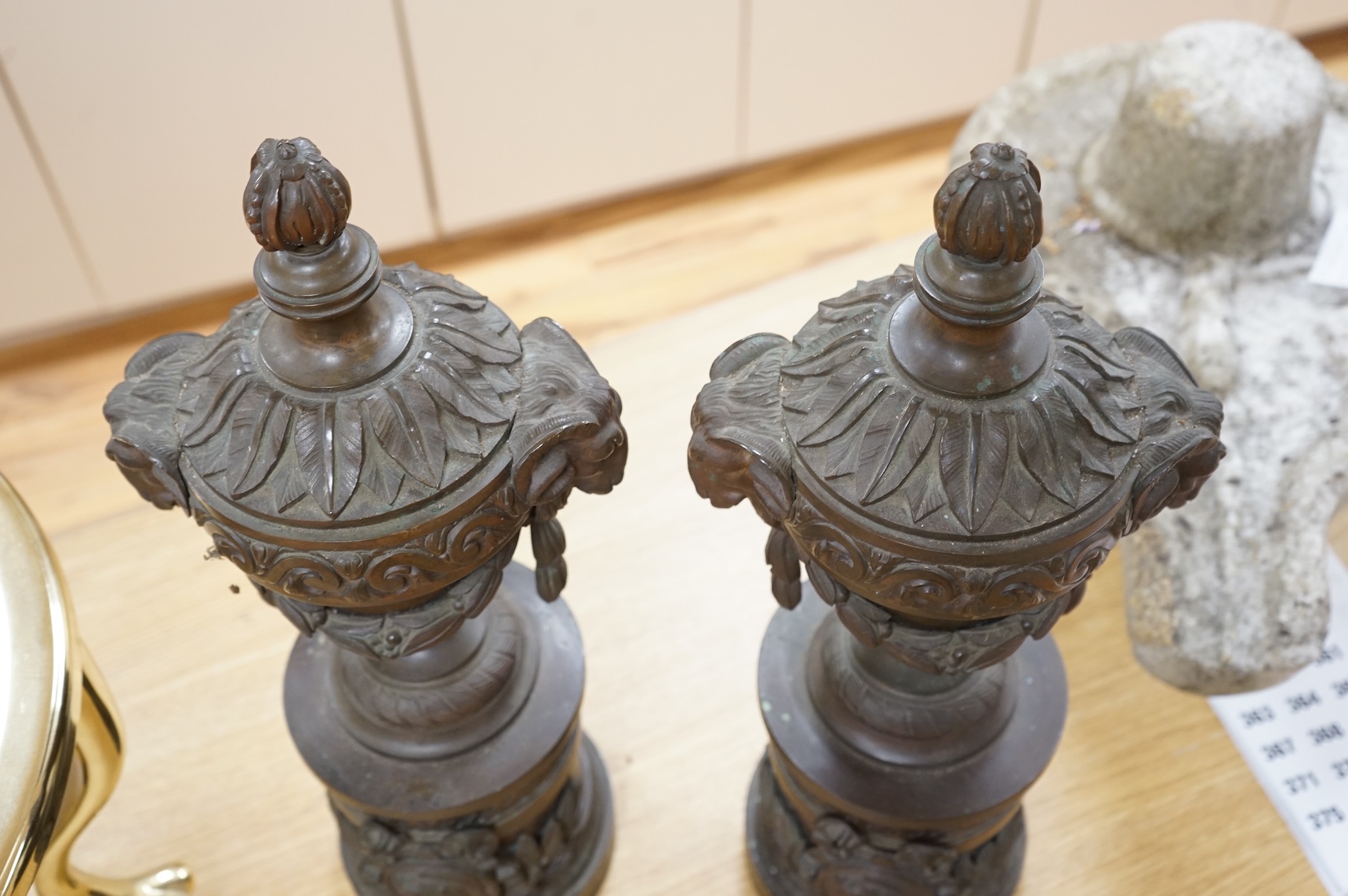 A pair of Grand Tour style bronze rams' head vases, H 55cm W 18cm